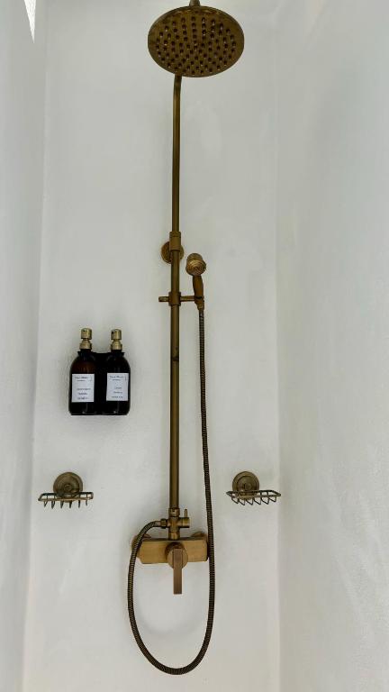 a shower in a bathroom with two bottles on the wall at Casa Moni con Vistas al Mar in Playa de Santiago