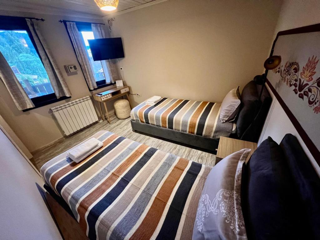 Postel nebo postele na pokoji v ubytování Китанова къща