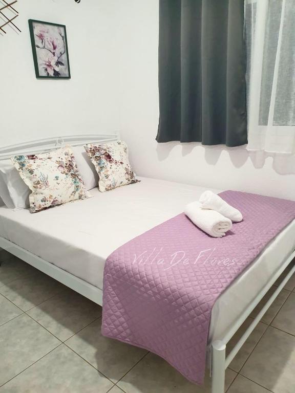 Postel nebo postele na pokoji v ubytování Villa De Flores