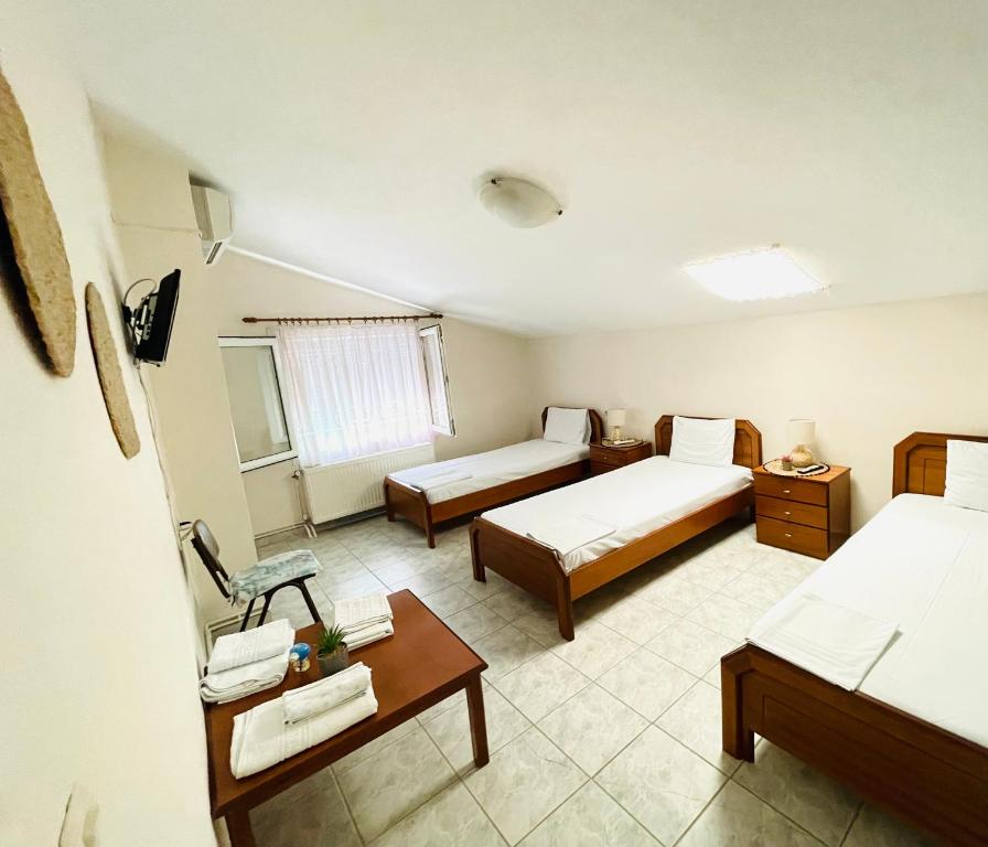 Postel nebo postele na pokoji v ubytování Aktaion Hotel