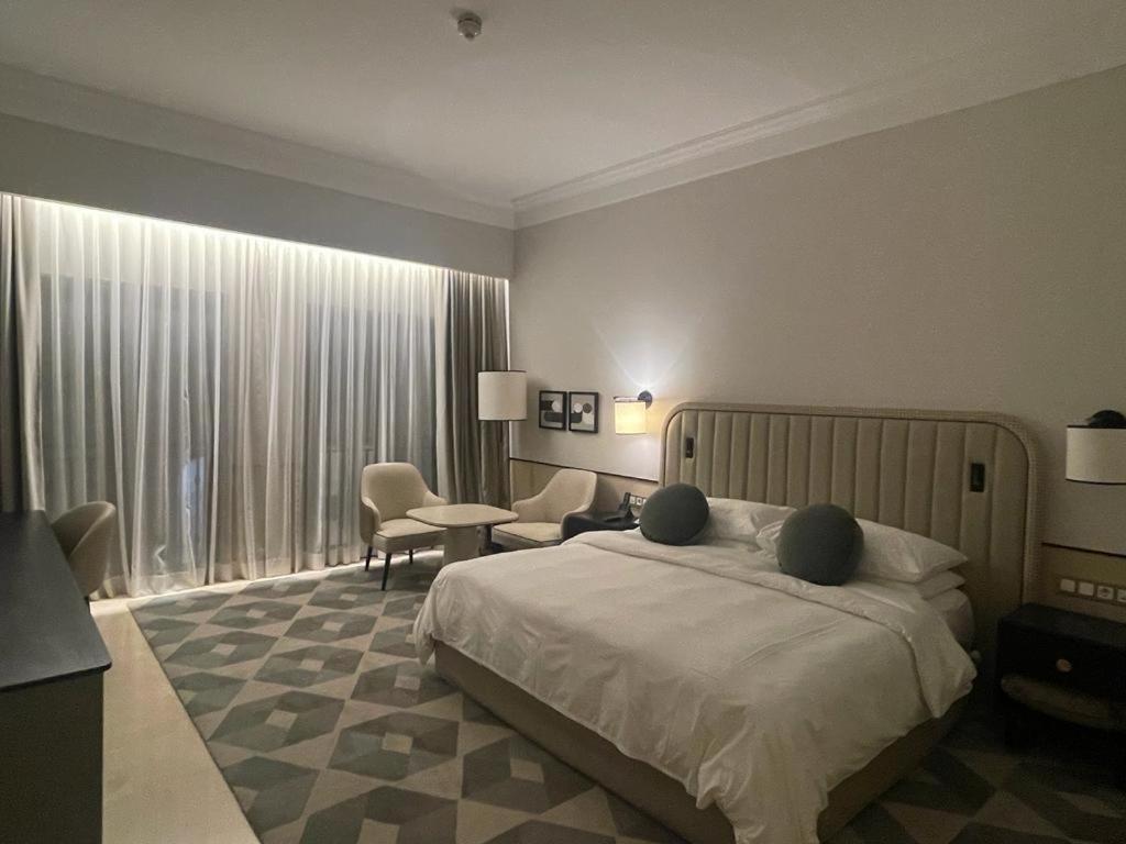 Postel nebo postele na pokoji v ubytování Address golf ,marassi