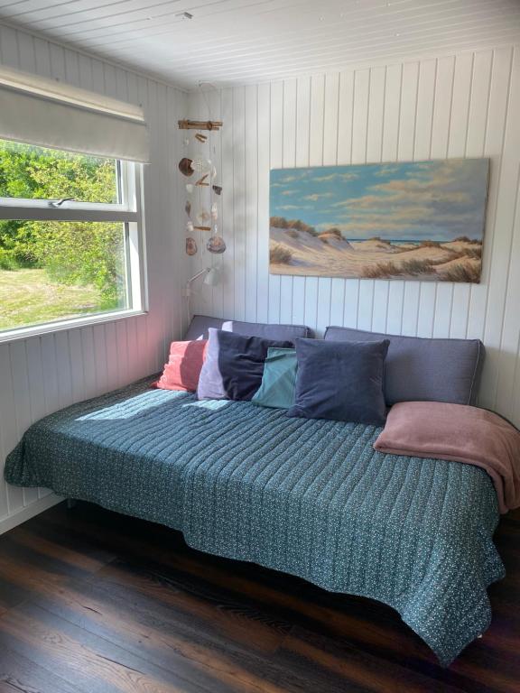 Postel nebo postele na pokoji v ubytování NyHus, Dragsmur, Mols