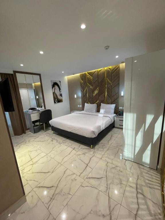 Postel nebo postele na pokoji v ubytování El Mesaadya Hotel فندق المساعدية