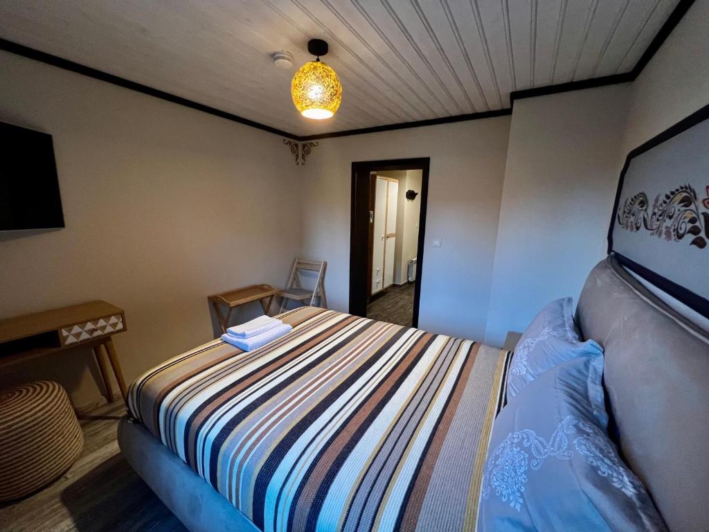 Postel nebo postele na pokoji v ubytování Китанова къща