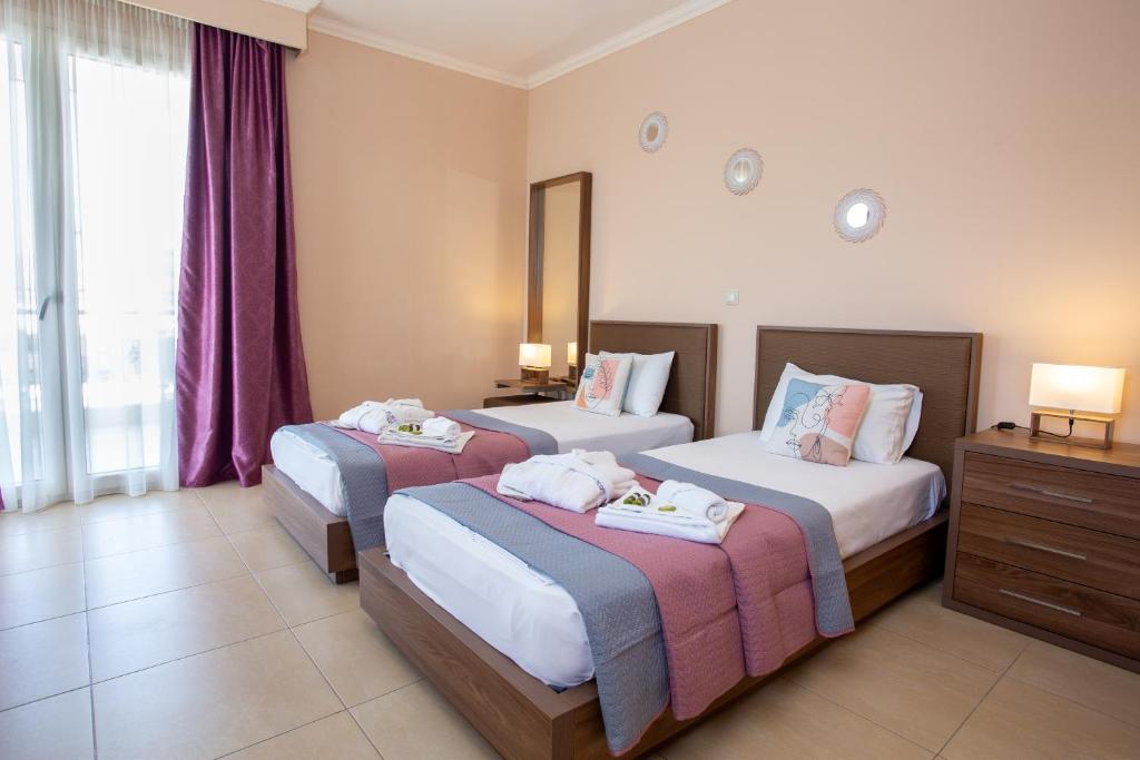Voodi või voodid majutusasutuse Orchidea Hotel toas