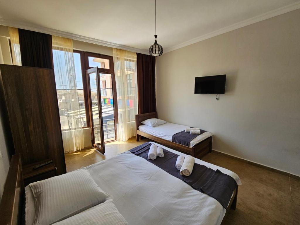 Postel nebo postele na pokoji v ubytování Guest House Gio