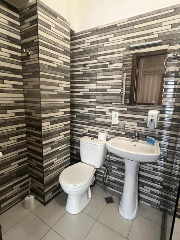 Koupelna v ubytování Magic Hotel