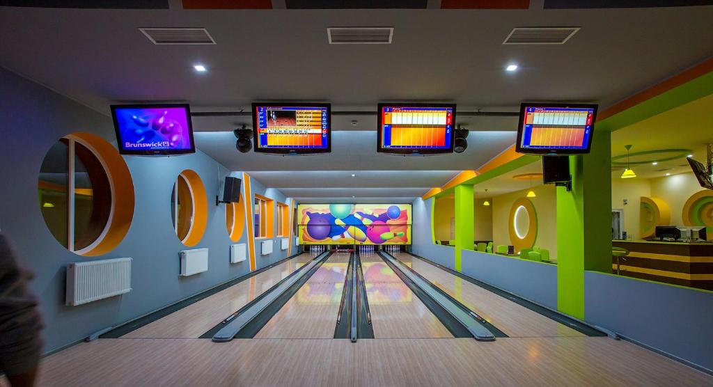 a bowling alley with pins in a game room at Mіnі Gotel Pozitiv in Horodets'ke