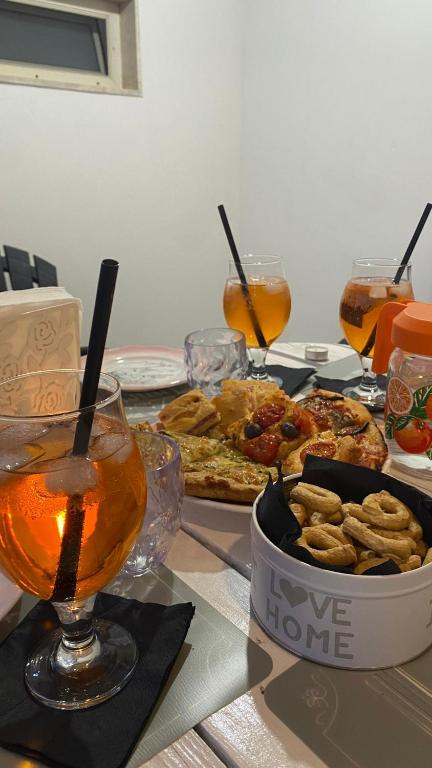 a table with food and drinks on a table at casa di zia Flora in Fasano