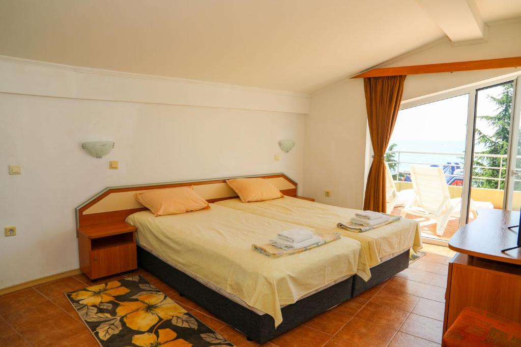 Postel nebo postele na pokoji v ubytování Hotel Sofia Beach