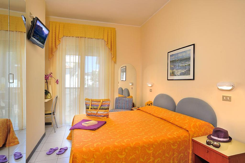 Postel nebo postele na pokoji v ubytování Hotel Venezia
