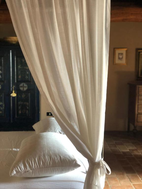 Postel nebo postele na pokoji v ubytování B&B Cascina Mattarelle