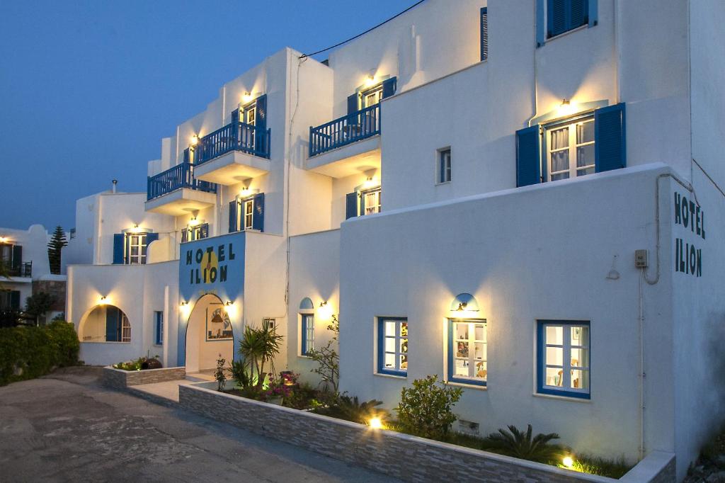 a hotel room with a large white building behind it at Ilion Hotel in Naxos Chora