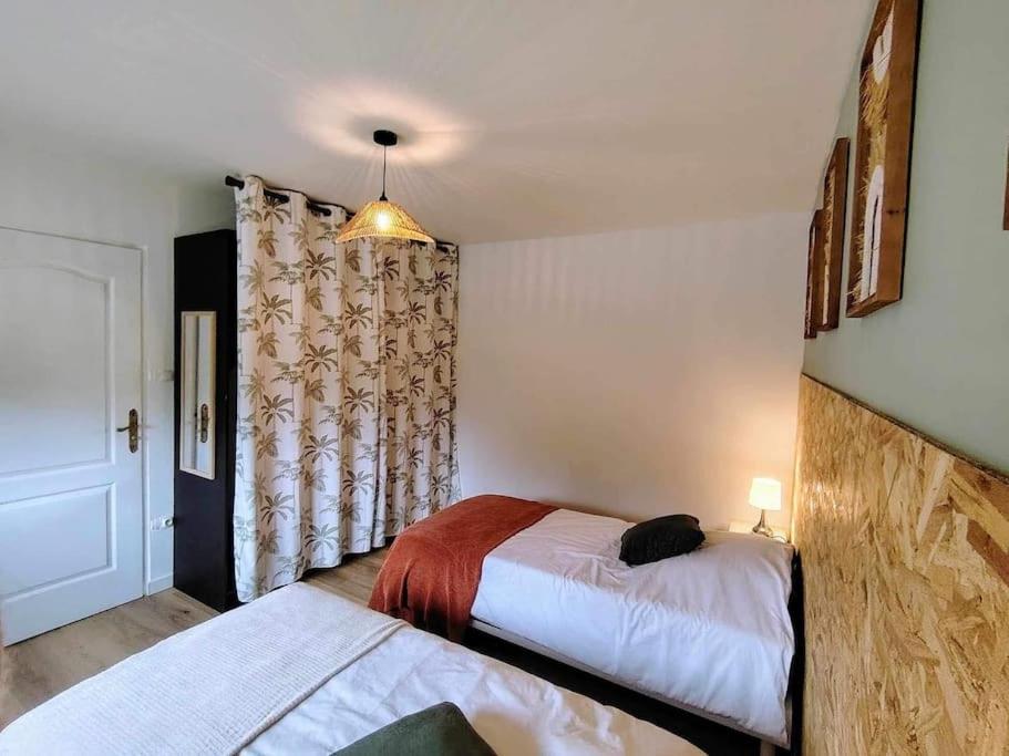 Postel nebo postele na pokoji v ubytování Le Jardin des Lacs Gîte Nature et SPA