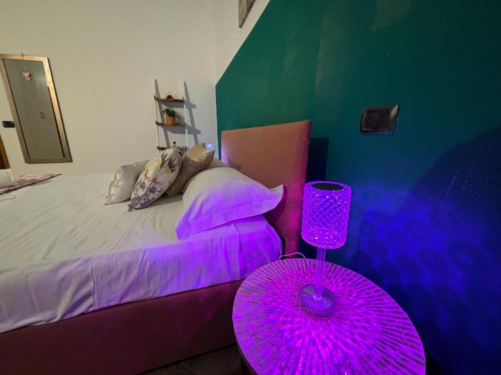 Postel nebo postele na pokoji v ubytování Rainbow Cinqueterre