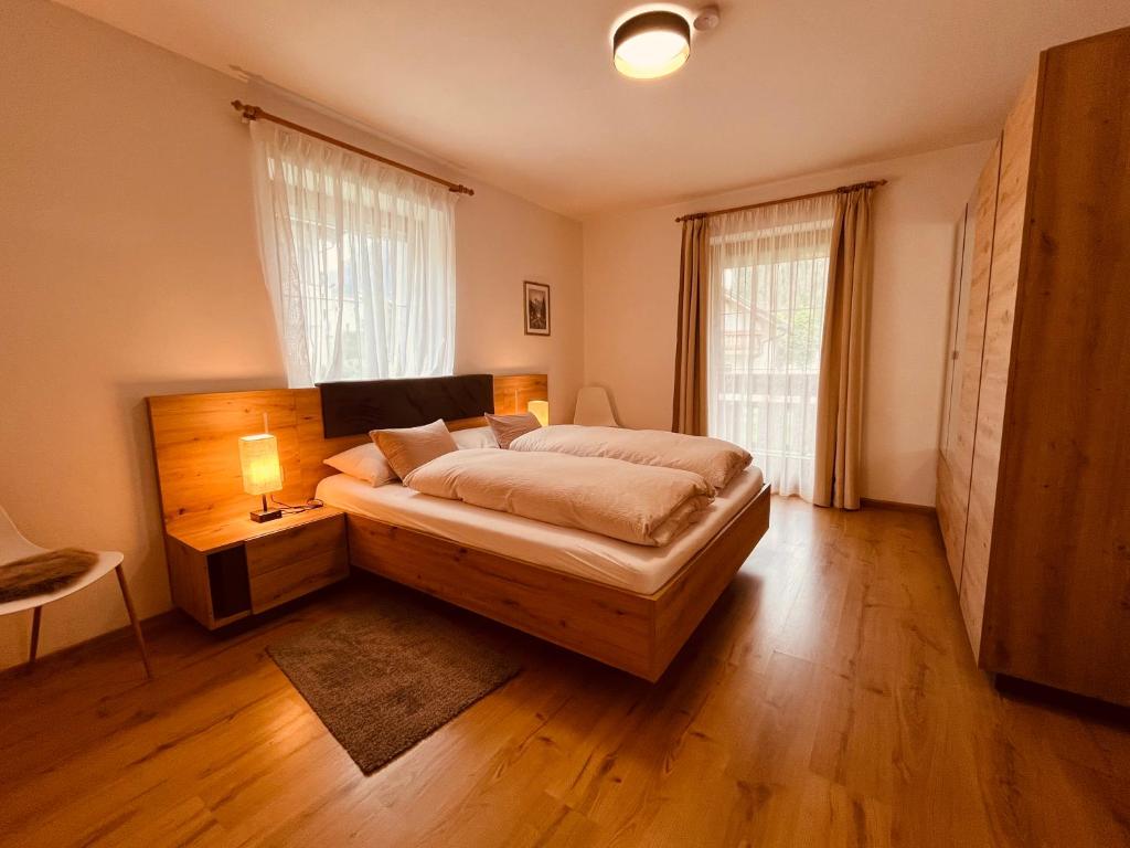 A bed or beds in a room at Ciasa Fam Comploi