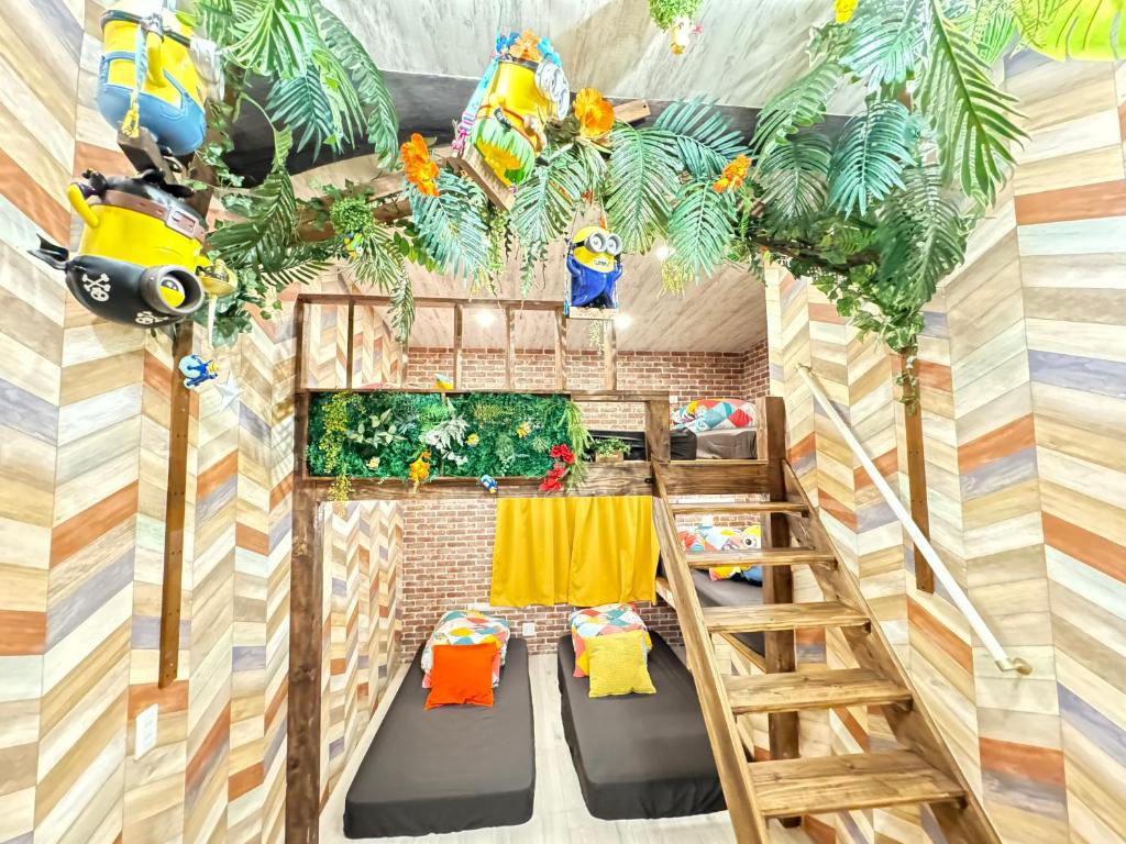 an interior view of a tiny house with a ladder at New open Hotel Jungle fun fun J4 USJ 8minutes nishikujyo 3minutes in Osaka