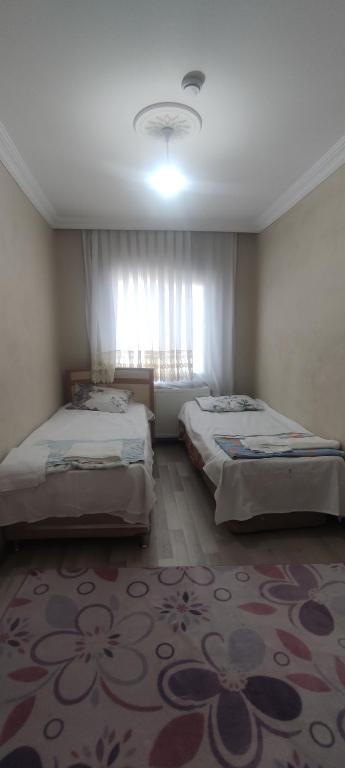 Postel nebo postele na pokoji v ubytování Levent Home