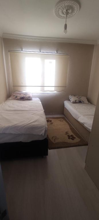 Postel nebo postele na pokoji v ubytování Levent Home