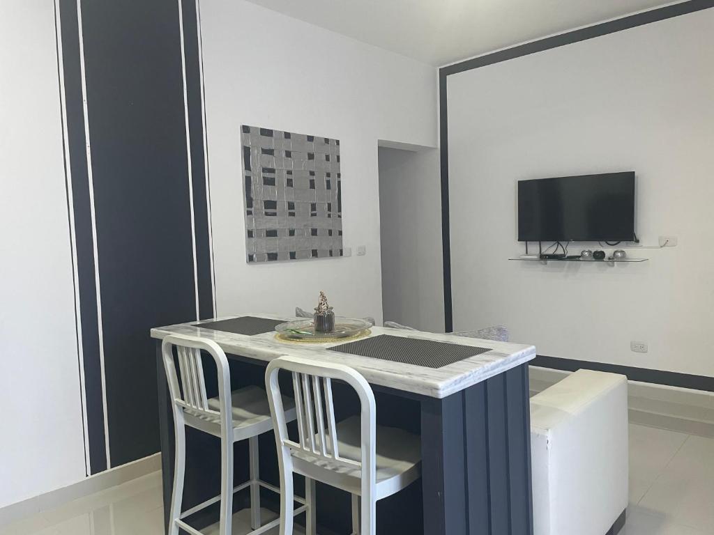 TV a/nebo společenská místnost v ubytování Gaia Residence Deluxe