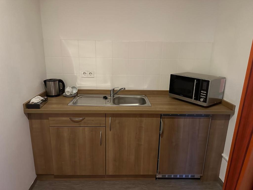 Kuchyň nebo kuchyňský kout v ubytování Hotel Efcannos