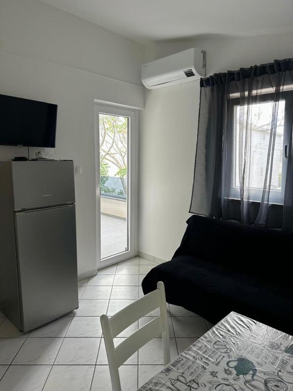 Televízia a/alebo spoločenská miestnosť v ubytovaní Apartments A&S