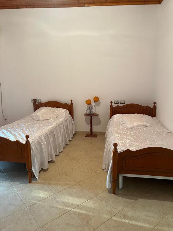 Postel nebo postele na pokoji v ubytování Nori House