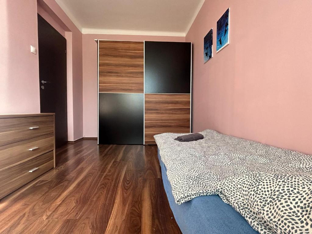 Postel nebo postele na pokoji v ubytování Apartman Rose