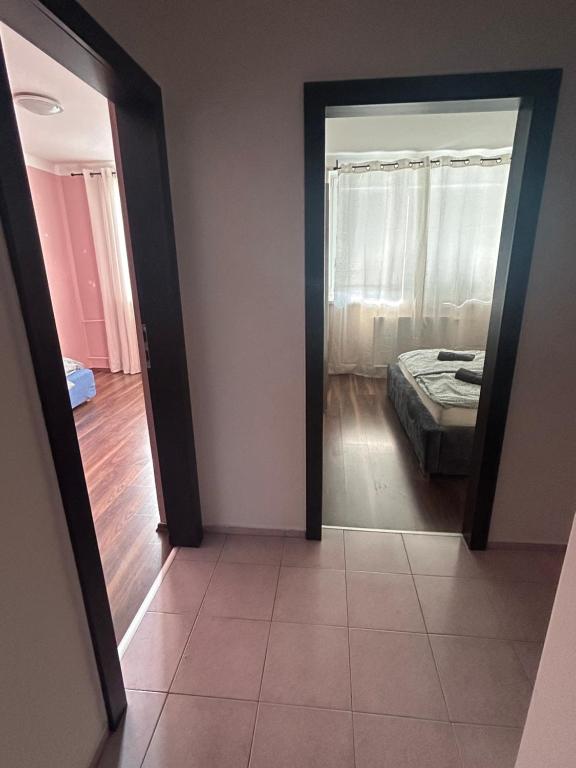 Postel nebo postele na pokoji v ubytování Apartman Rose