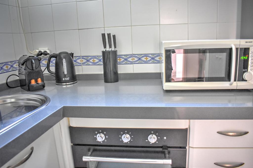 Kuchyň nebo kuchyňský kout v ubytování Apartamento Los Olivos Jerez