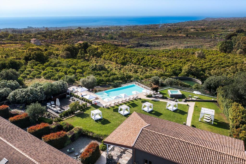 an aerial view of a house with a swimming pool at Kepos Etna Relais & Exclusive Spa in Santa Venerina