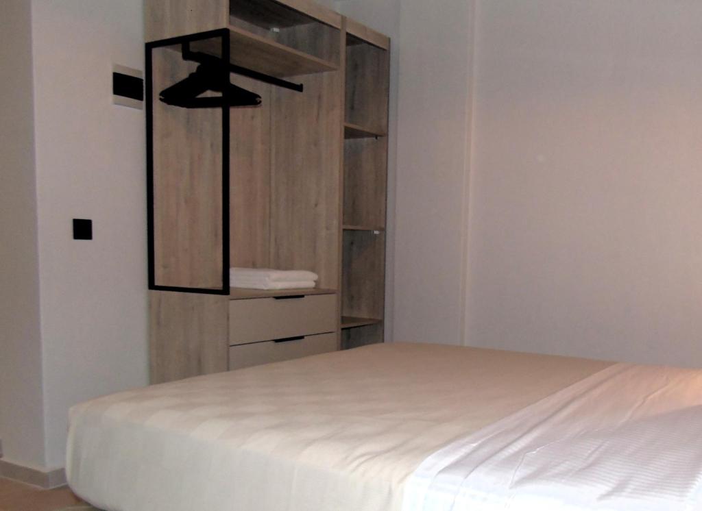 Postel nebo postele na pokoji v ubytování Studios - Nostos