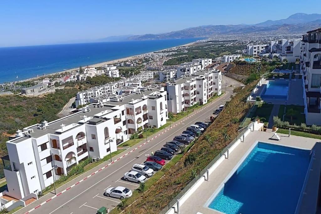 an apartment with a view of the beach and buildings at Appartement bella vista in Cabo Negro