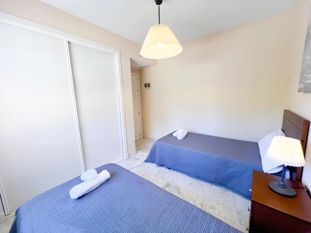 Posteľ alebo postele v izbe v ubytovaní Apartamento la Reserva de Marbella