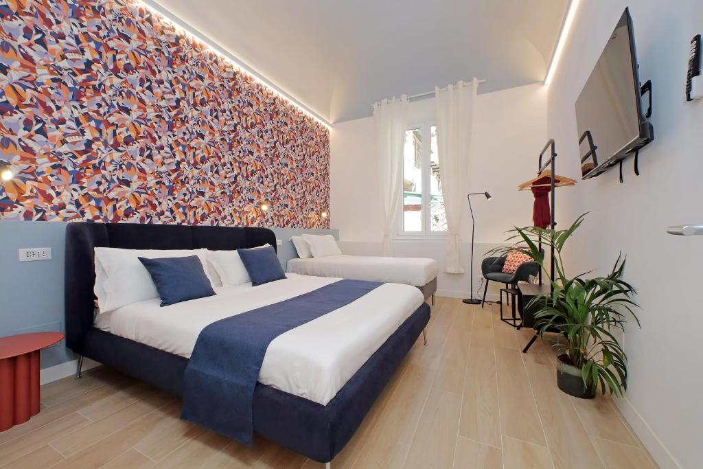 Posteľ alebo postele v izbe v ubytovaní Redseven Rome Apartments