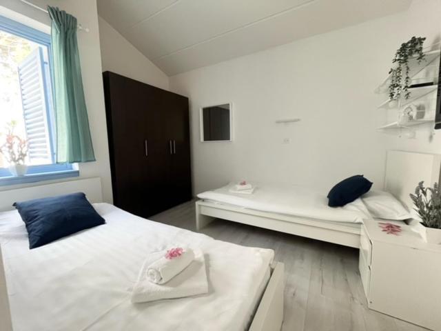 Ένα ή περισσότερα κρεβάτια σε δωμάτιο στο SeaFun Apartment Gajac