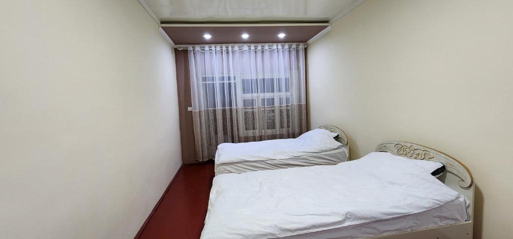 Postel nebo postele na pokoji v ubytování Sim-Sim Hostel