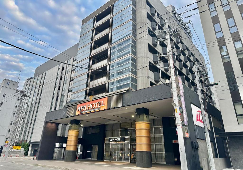 a building with a sign on the front of it at APA Hotel TKP Sapporo Eki-Kitaguchi Excellent in Sapporo