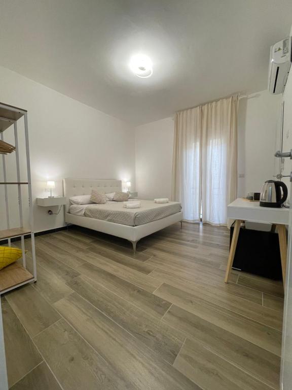 Postel nebo postele na pokoji v ubytování Tra te e il Mare
