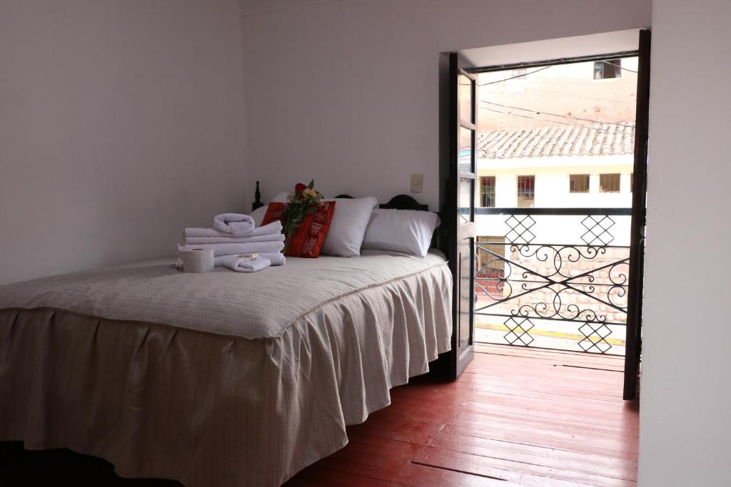 Postel nebo postele na pokoji v ubytování Millas House Cusco
