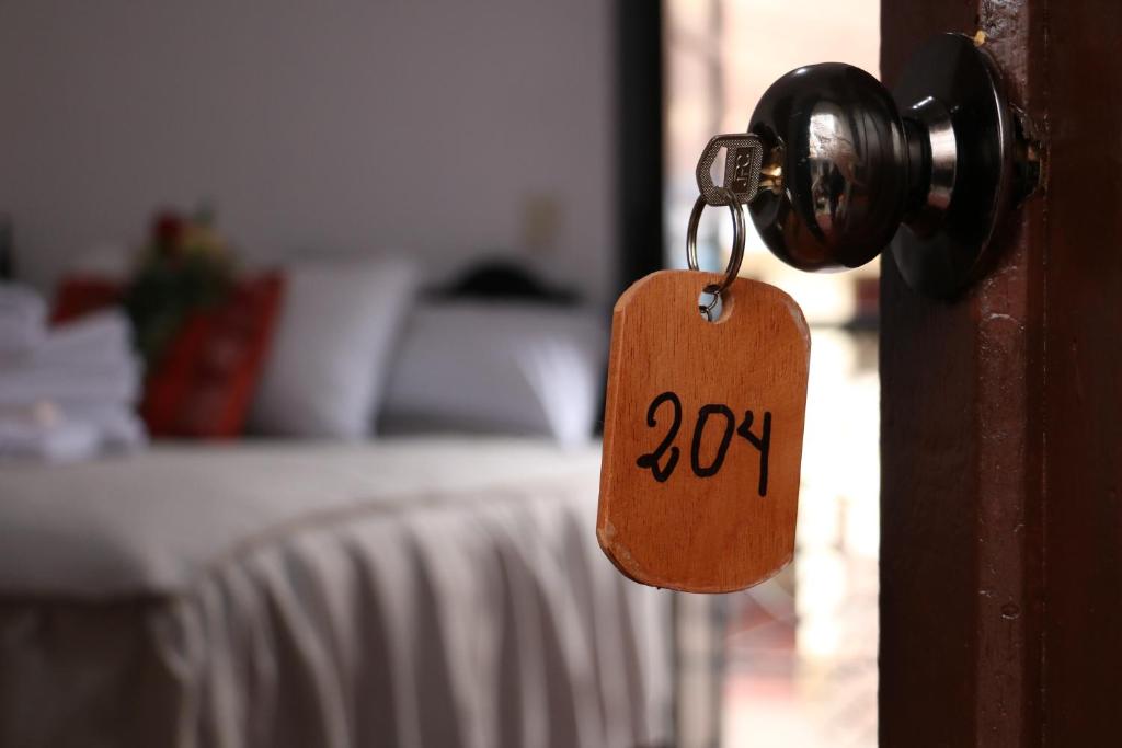 Postel nebo postele na pokoji v ubytování Millas House Cusco
