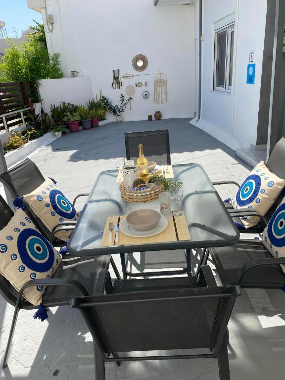 a table and chairs sitting on a patio at Sweet Home Kremasti in Kremasti