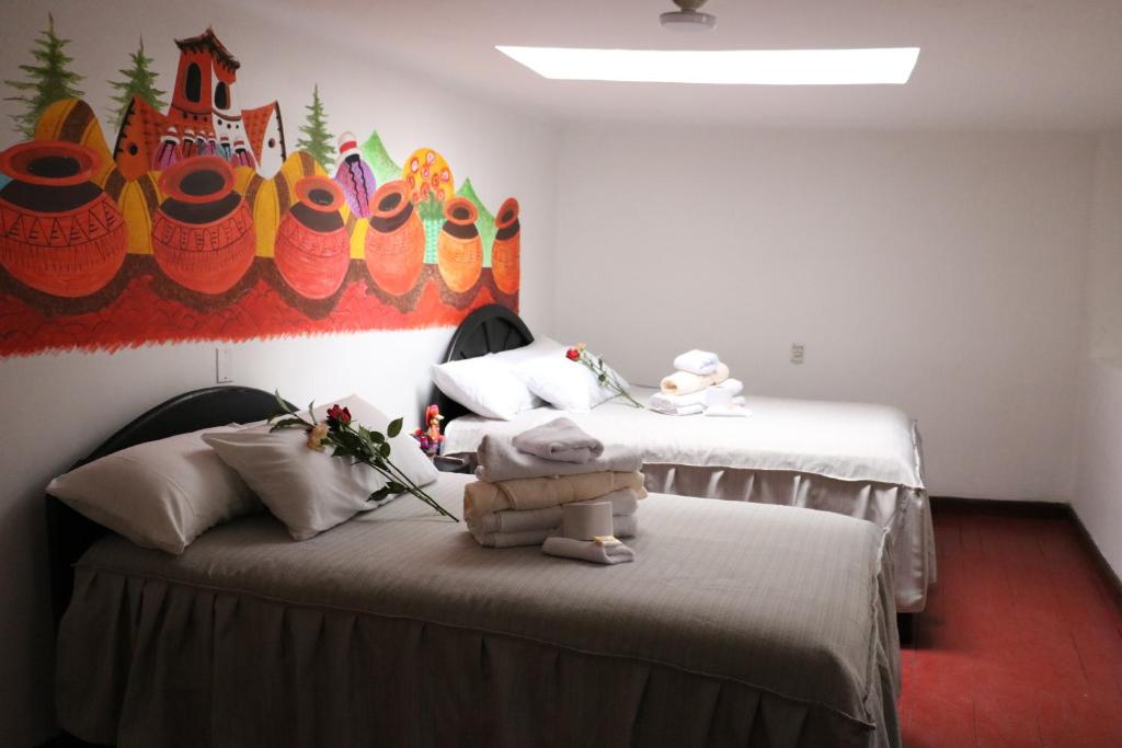 Postel nebo postele na pokoji v ubytování Millas House Cusco