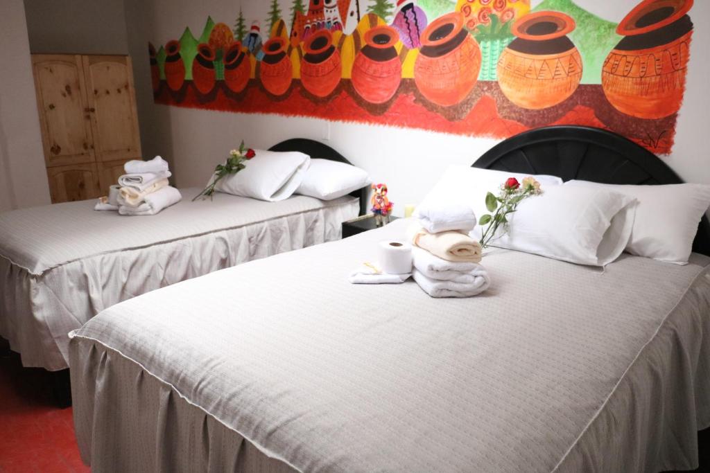 Postel nebo postele na pokoji v ubytování Millas House Cusco