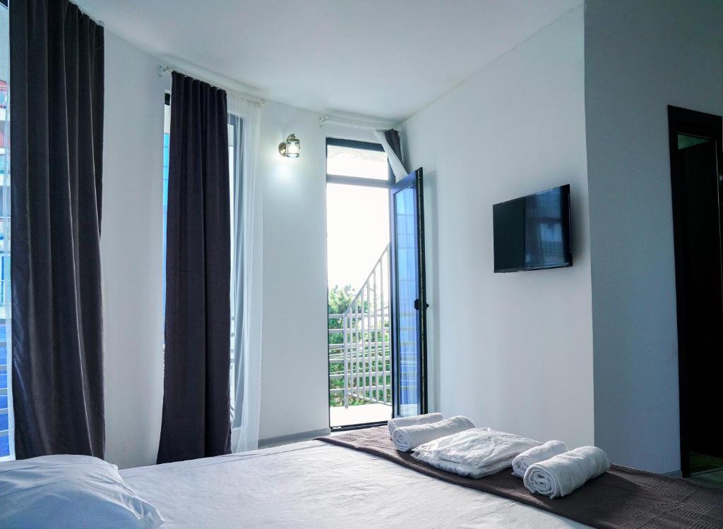 Ένα ή περισσότερα κρεβάτια σε δωμάτιο στο Hotel General Tso Kobuleti