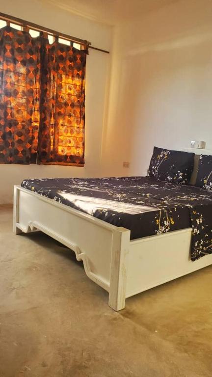 Postel nebo postele na pokoji v ubytování Raphy Home