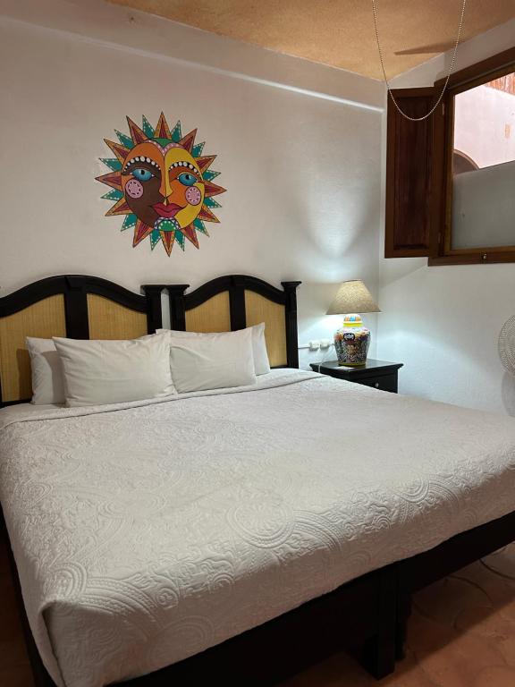 Postel nebo postele na pokoji v ubytování Hotel del Sol