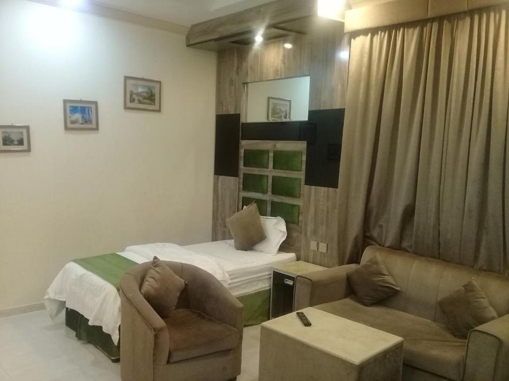 Postel nebo postele na pokoji v ubytování خالد بن علي ضيافة خاص