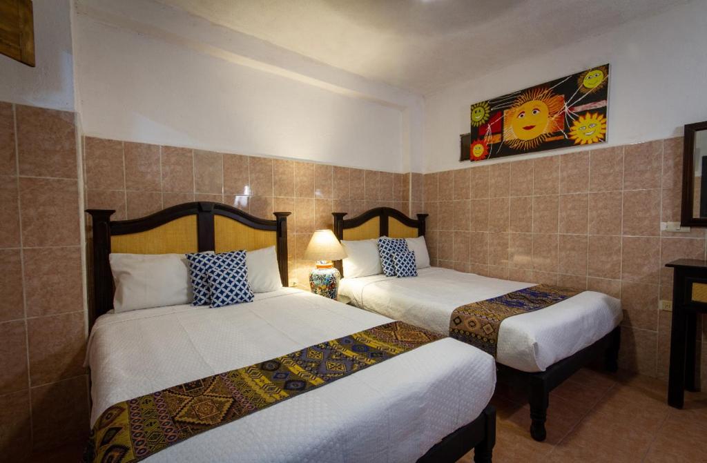 Postel nebo postele na pokoji v ubytování Hotel del Sol