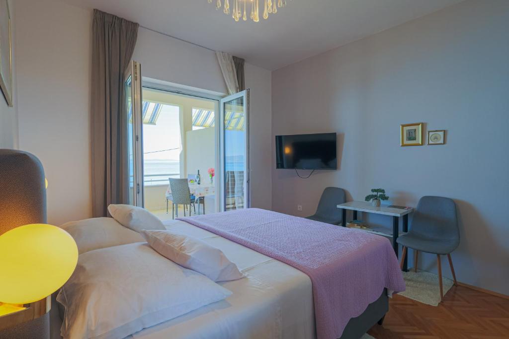 Posteľ alebo postele v izbe v ubytovaní Marin Apartments